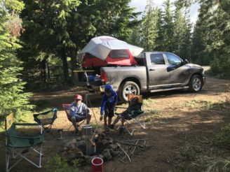 campfire and rooftop tent